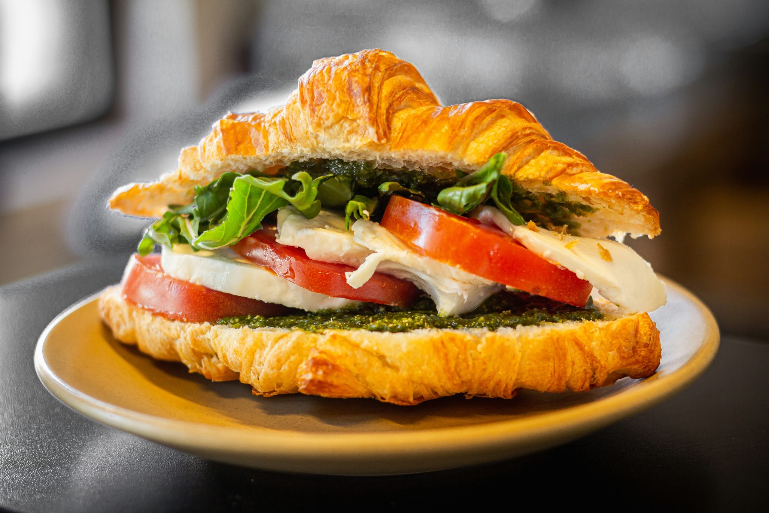 A croissant filled with cheese and tomato